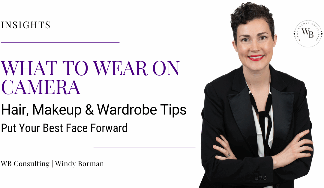 Windy Borman, a woman with short, dark, curly hair, wears a tuxedo jacket, white shirt, and loose black tie. She smiles, wearing red lipstick, and crosses her arms. Windy Borman is a Fractional Director of Content. She helps Founders and CEOs amplify their stories across film, media, and events.